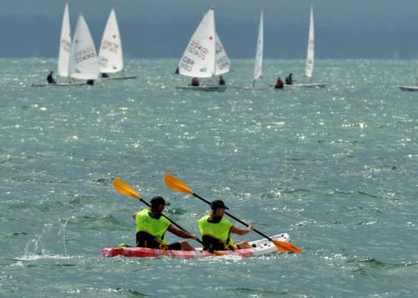 Kayaking firefighters on their fundraising paddle around Hayling Island   Picture: Mick Young