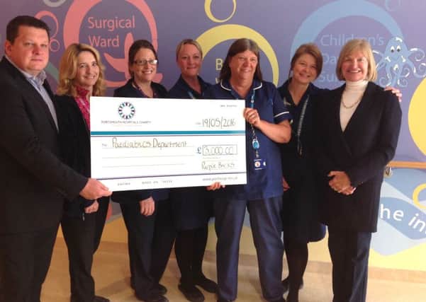 Staff from Purplebricks with a cheque for the Children's Assessment Unit at Queen Alexandra Hospital