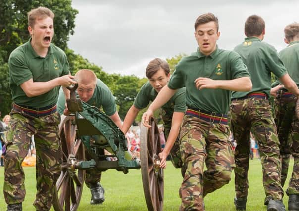 Members of the Royal Marines Cadets from HMS Excellent in action during a running of the field gun competition Picture by Keith Woodland