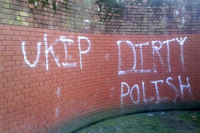 Racist graffiti spray-painted on the wall near the war memorial at Guildhall Square in Portsmouth