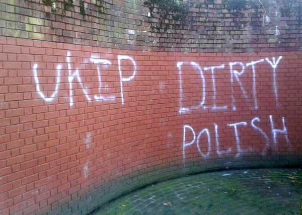 Racist graffiti spray-painted on the wall near the war memorial at Guildhall Square in Portsmouth