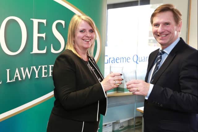 Alison Lee, the managing director of Biscoes Law, and Graeme Quar, the managing director of Graeme Quar & Co, mark the law firms' merger