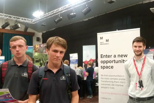 From left, Ben Jones and Barney Johnson, Year 10 pupils at Bay House School, with Edward Blake from business Mott Macdonald