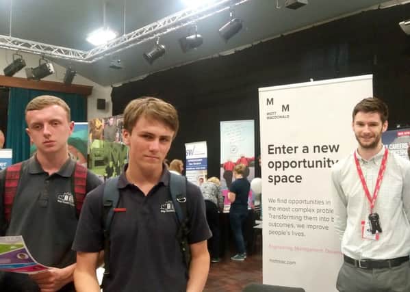 From left, Ben Jones and Barney Johnson, Year 10 pupils at Bay House School, with Edward Blake from business Mott Macdonald