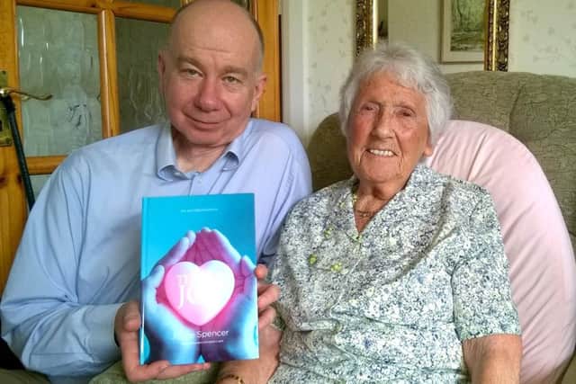 Joyce Spencer, 90, from Emsworth, with her autobiography and her ghost writer Edward Couzens-Lake