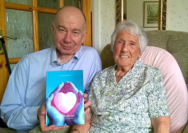 Joyce Spencer, 90, from Emsworth, with her autobiography and her ghost writer Edward Couzens-Lake