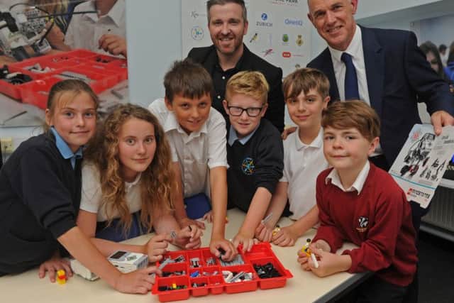 From left, Lilly Watts, 10, from Elson Junior School, Liwia Ochwat, 11, from  Siskin Junior School, Axl Rose, 11, from Siskin, Oakley Herridge, nine from Elson, Stanley Law, nine, from Brockhurst Junior School and Jaydon Kent, eight, from Brockhurst. With them are Gareth Boldsworth from Lego, left, and Stephen Shaw from Brune Park Picture: Ian Hargreaves (160965-1)