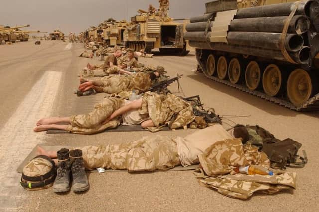 Royal Scots Dragoon Guards taking a break after a night of fighting in Southern Iraq in 2003