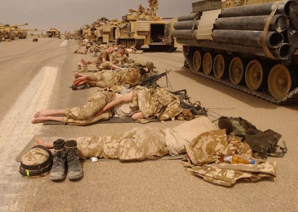 Royal Scots Dragoon Guards taking a break after a night of fighting in Southern Iraq in 2003