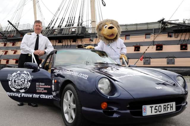Commander Steve Shaw from the Royal Navy and Rally for Heroes Mascot Roary the Lion