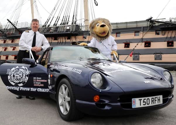 Commander Steve Shaw from the Royal Navy and Rally for Heroes Mascot Roary the Lion
