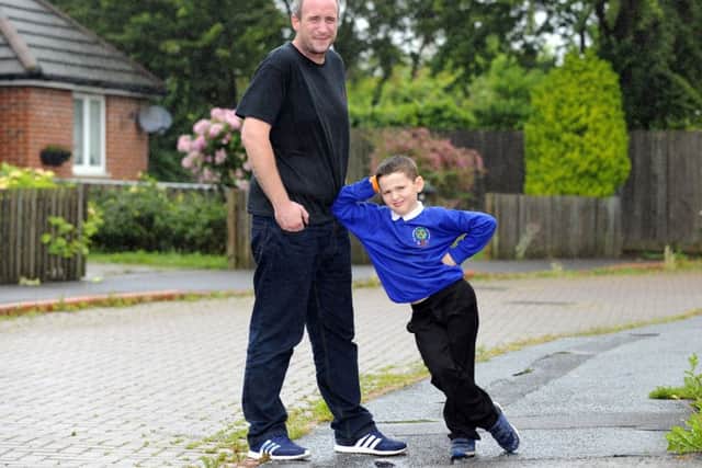 Craig Sterne, 34, from Gosport has lost five stone to now weigh 16 stone, and can run to school with his youngest child Jayden
Picture: Malcolm Wells (160629-0199)