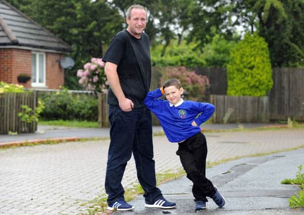 Craig Sterne, 34, from Gosport has lost five stone to now weigh 16 stone, and can run to school with his youngest child Jayden


Picture: Malcolm Wells (160629-0199)