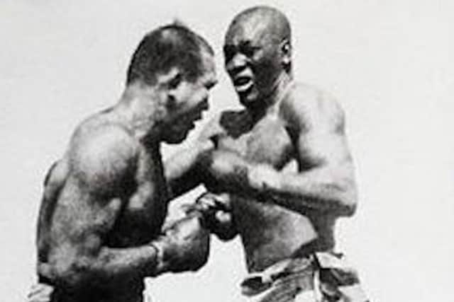 Jim Jeffries (left) tangling with Jack Johnson in a fight the promoters wanted Arthur Conan Doyle to referee.