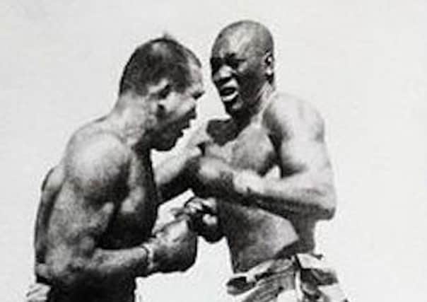 Jim Jeffries (left) tangling with Jack Johnson in a fight the promoters wanted Arthur Conan Doyle to referee.