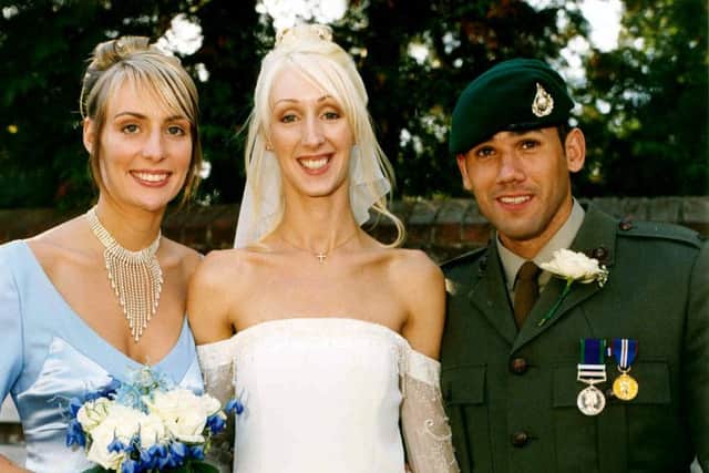 Ben Nowak at his sister Katie's wedding in September 2003, with their sister Lucie on the left
