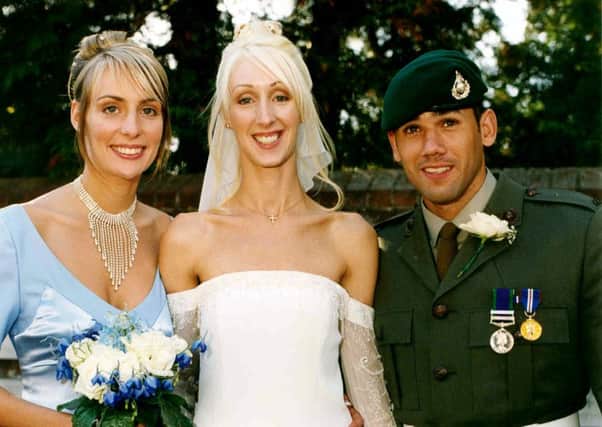 Ben Nowak at his sister Katie's wedding in September 2003, with their sister Lucie on the left