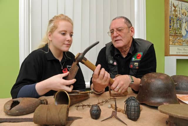 Charles Haskell and Daisy Potter look at First World War items