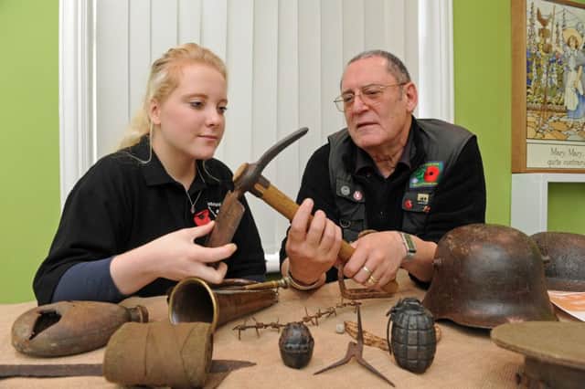 Charles Haskell and Daisy Potter look at First World War items