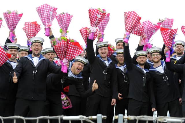 HMS Iron Duke's sailors with bouquets Picture: Malcolm Wells (160707-1074)