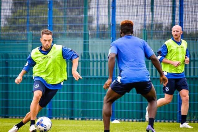 Milan Lalkovic, left, and Drew Talbot, far right, have both been signed on a permanent basis by Pompey manager Paul Cook this summer   Picture: Colin Farmery