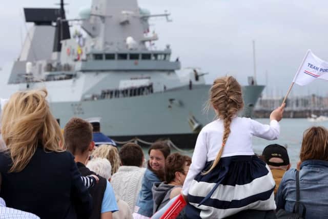The Band of Her Majestys Royal Marines Portsmouth performed on the jetty as the crowds eagerly awaitied the return of sailors on board