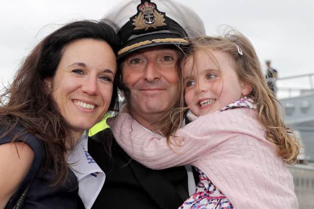 CO of HMS Defender Cdr Stephen Higham with wife Casandra Higham and daughter Georginna