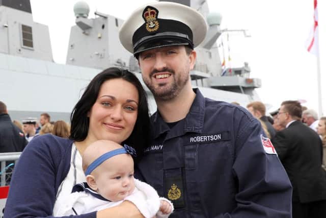 CPO (ETME) Robertson from Fareham welcomed home by wife Kayleigh and daughter Avasent held at FRPU(E)