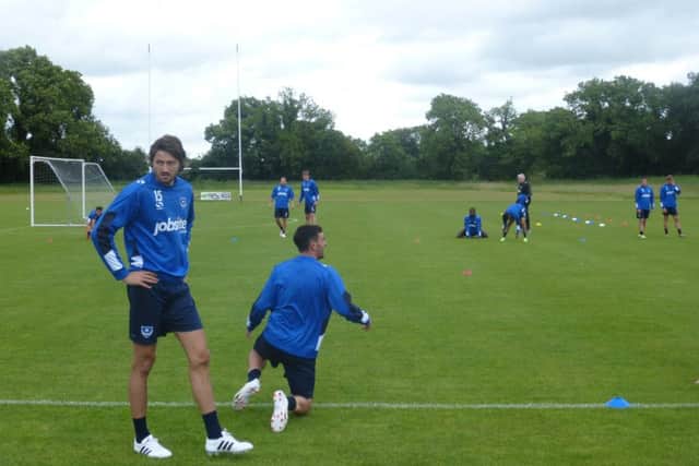 Pompey's players take a break during a training session on their pre-season tour of Ireland   Picture: Neil Allen