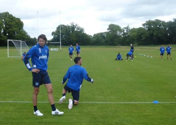 Pompey's players take a break during a training session on their pre-season tour of Ireland   Picture: Neil Allen