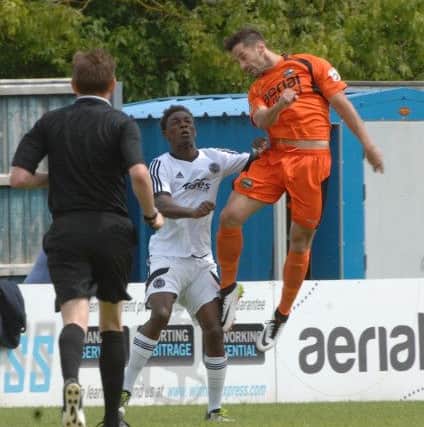 TJ Cutherbertson battles for a header. Picture: Andy Fitzsimons