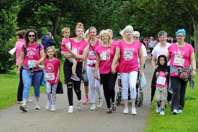 Natalie Turner was supported by her mum, sisters, family and friends as they came along Ladies' Mile in yesterday's Race for Life Picture: Malcolm Wells (160710-1730)