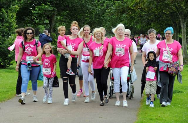 Natalie Turner was supported by her mum, sisters, family and friends as they came along Ladies' Mile in yesterday's Race for Life 

Picture: Malcolm Wells (160710-1730)
