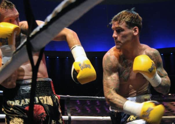Joel McIntyre has Slovakian opponent Vladimir Idranyi on the ropes Picture: Mick Young