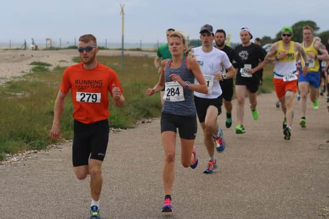 Jen Elkins, running alongside James Sawyer in the Bayside 5k Series. Picture: David Brawn