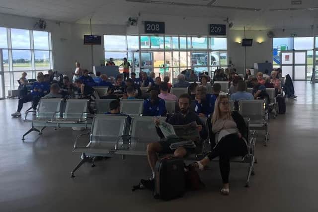 The Pompey players had a near two-hour wait to board their flight home at Dublin airport