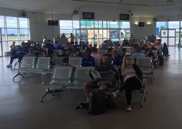 The Pompey players had a near two-hour wait to board their flight home at Dublin airport
