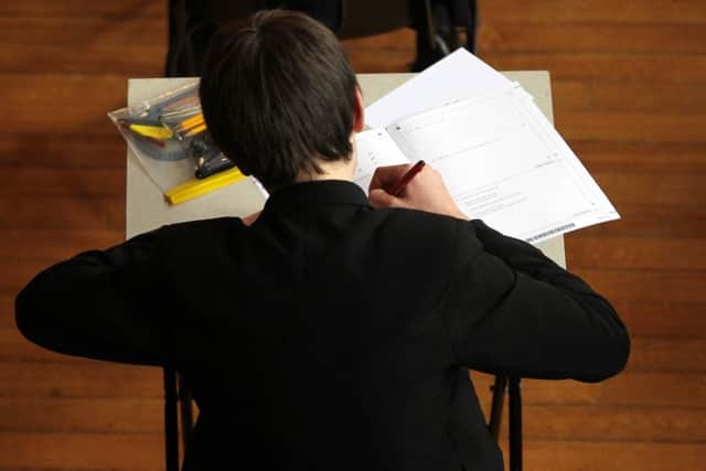 File photo dated 02/03/12 of a pupil sitting a maths exam as too many students are starting science and engineering degrees without studying maths at A-level, according to a report. ENGPPP00120120814145127