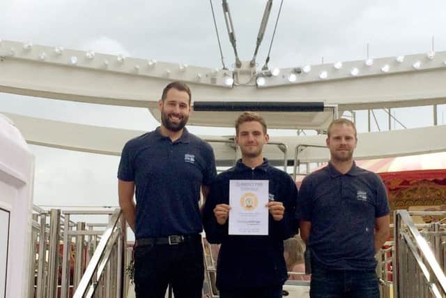 Solent Wheel management receiving the award, from left, 
Zoltan Banyi, Jordan Wells and West Manning