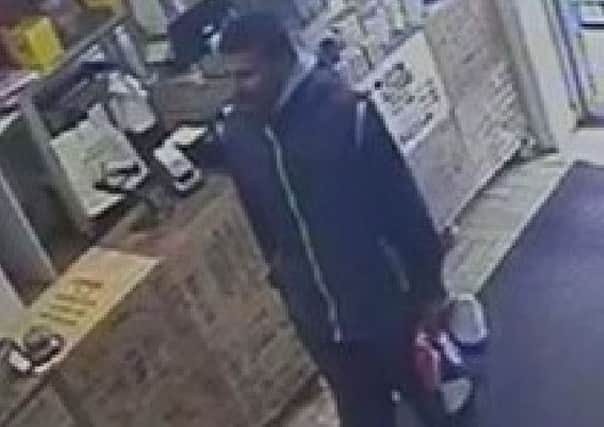 CCTV footage of the suspect police are looking for following the raid at All About Tea, in Somerstown.