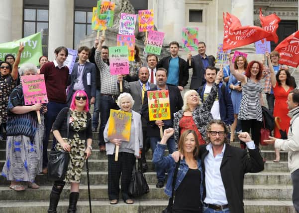 Save The Lodge supporters on the steps of Portsmouth Guildhall. Front bottom right, Alison Brett with owner Mark Lewis Picture by: Malcolm Wells (160712-5982)
