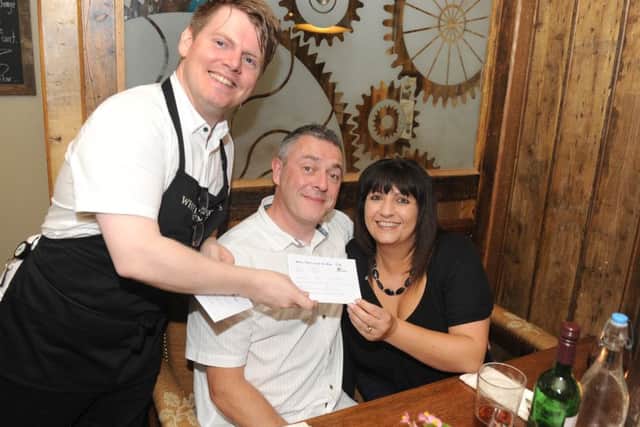 From left, manager Sean Clapson with Shane and Michelle Braiden from Havant
Picture: Sarah Standing (160931-5819)