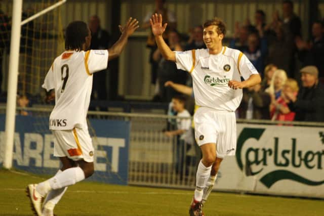Wes Fogden celebrates a goal during his first Hawks spell