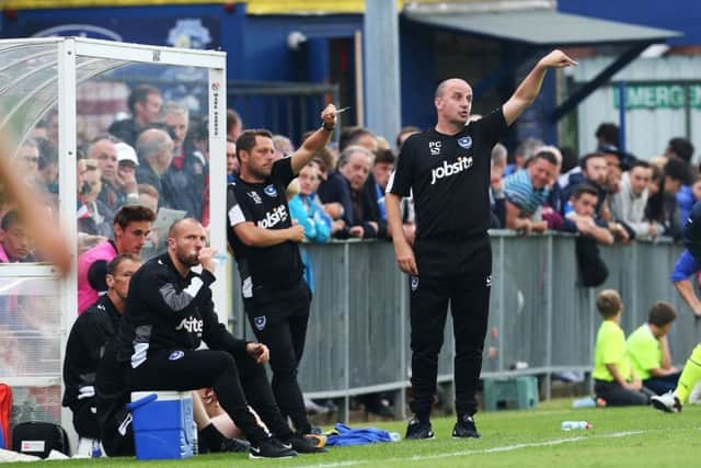 Pompey boss Paul Cook and his assistant Leam Richardson. Picture: Joe Pepler