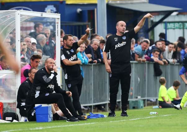 Pompey boss Paul Cook and his assistant Leam Richardson. Picture: Joe Pepler