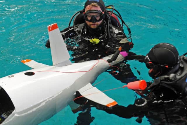 One of the teams operates a submarine