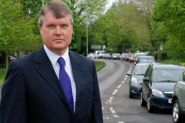 Leader of Fareham Borough Council Cllr Sean Woodward with traffic that would be alleviated when a Stubbington bypass is built