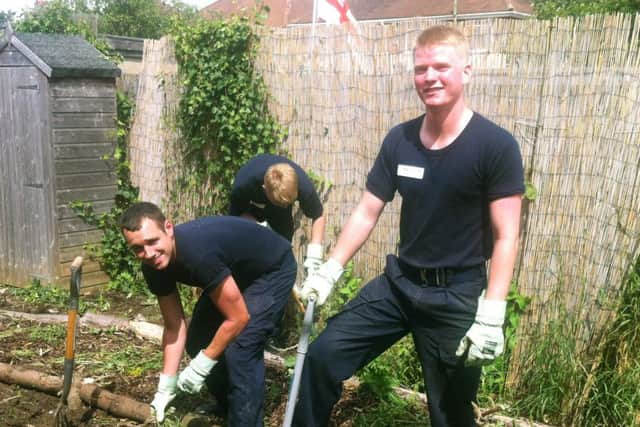 Air Engineering Technicians Joe Davies and Kieran Wilson working at Brockhurst Infant School