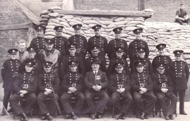George Warren Snr is in the back row, second from the right, but his son has no idea where or when this picture was taken
