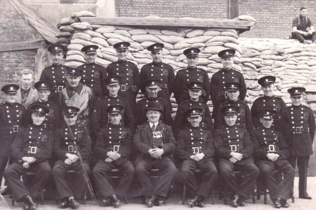 George Warren Snr is in the back row, second from the right, but his son has no idea where or when this picture was taken